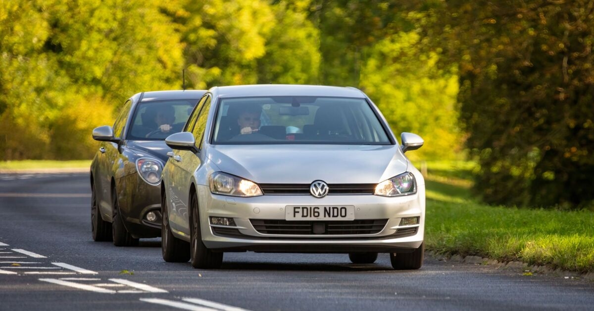 Woman driving on motorway has perfect response to tailgater without braking